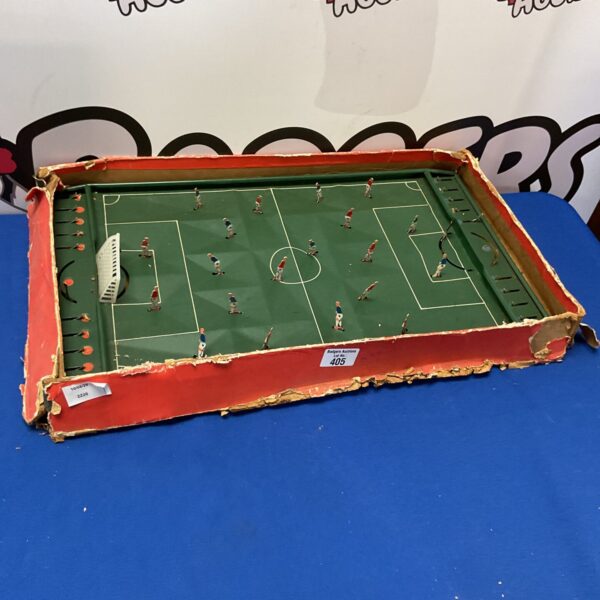 Vintage tinplate football table game with colourful players.