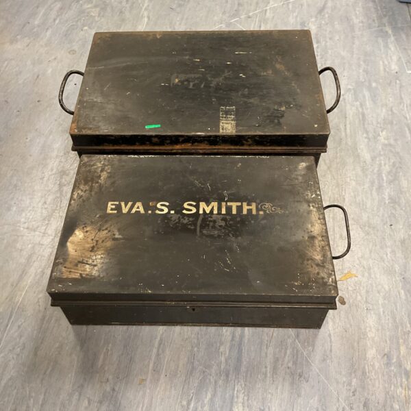 Pair of vintage metal deed boxes for document storage.