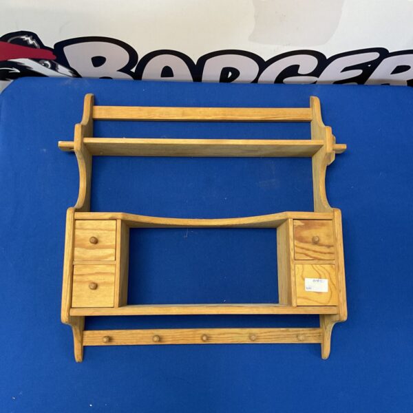 Small pine kitchen shelf unit with drawers and open shelving.