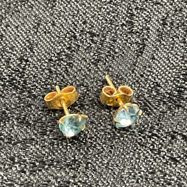 Pair of 9ct gold stud earrings set with aquamarine colour stones
