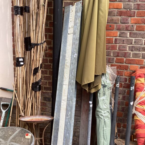 Metal builders lintel measuring 83 inches, showing signs of wear.