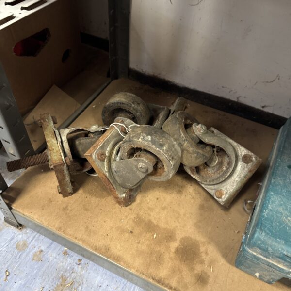 Four vintage heavy duty castor wheels