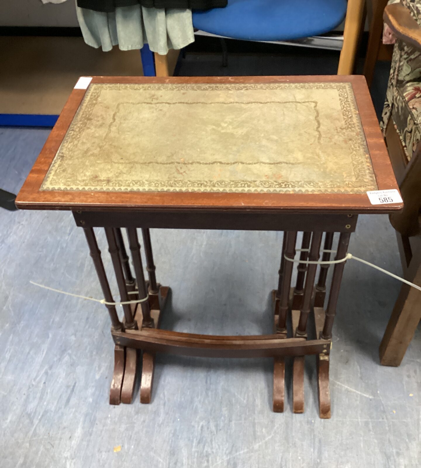 Nest of three leather topped tables