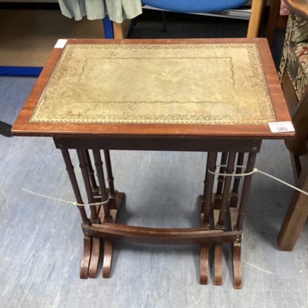 Nest of three leather topped tables