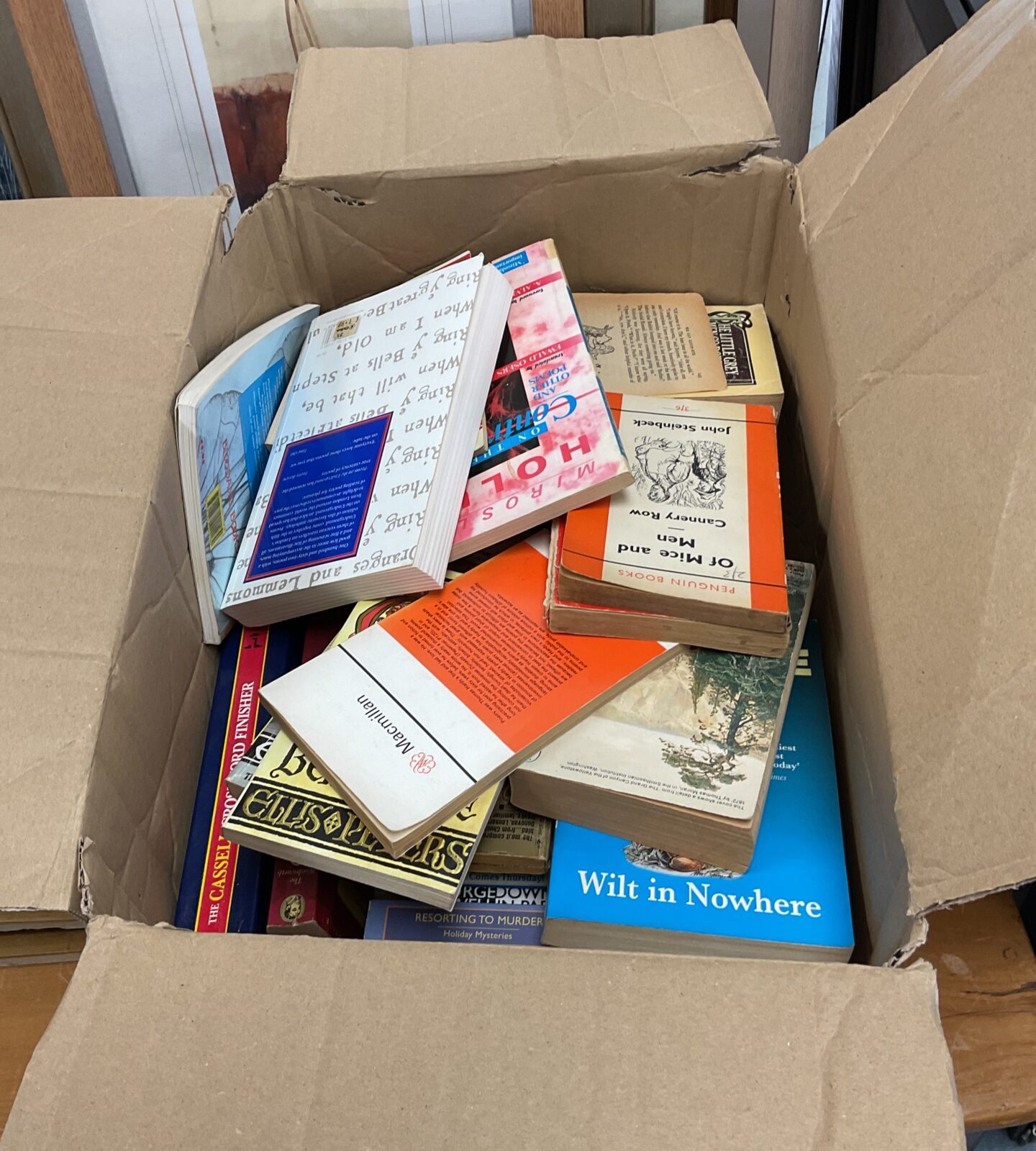 Box of vintage paperback books including penguin