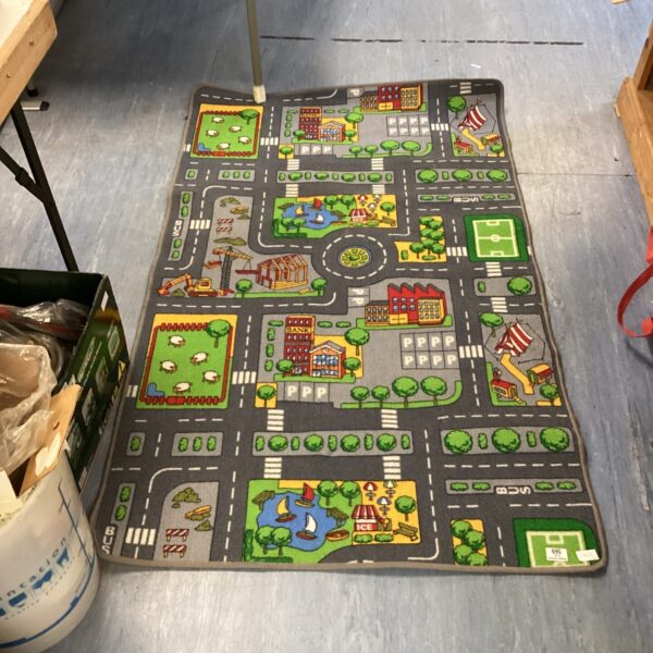 Colourful child's play rug with a town scene for imaginative play.