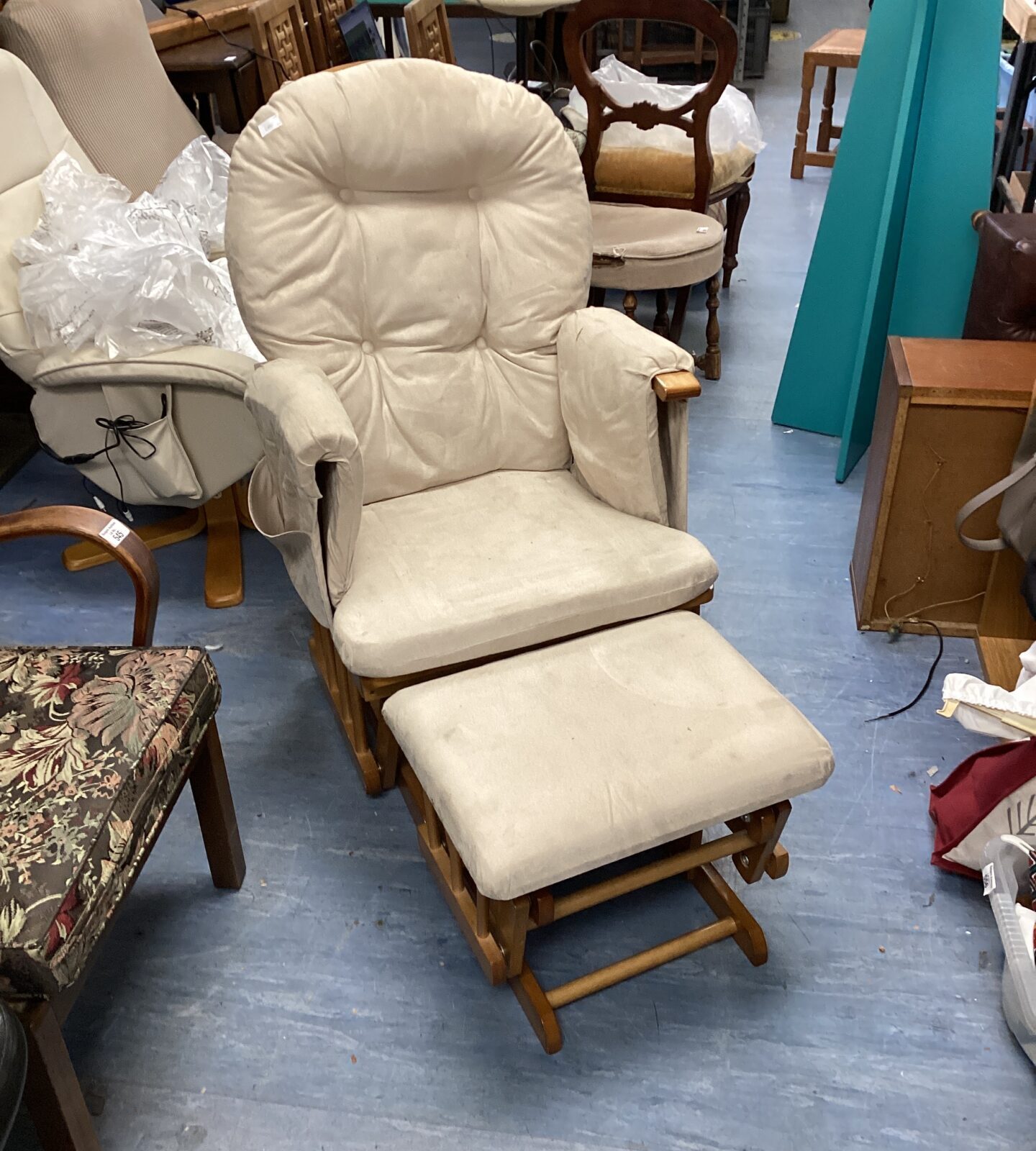 Rocking chair with rocking footrest