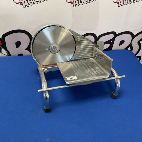 Vintage Graef meat slicer with chrome finish and large blade.