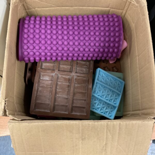 Assorted silicone moulds for baking and chocolate making.