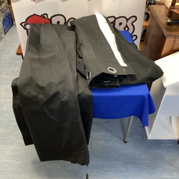 Full length black curtains for window covering and room decor.