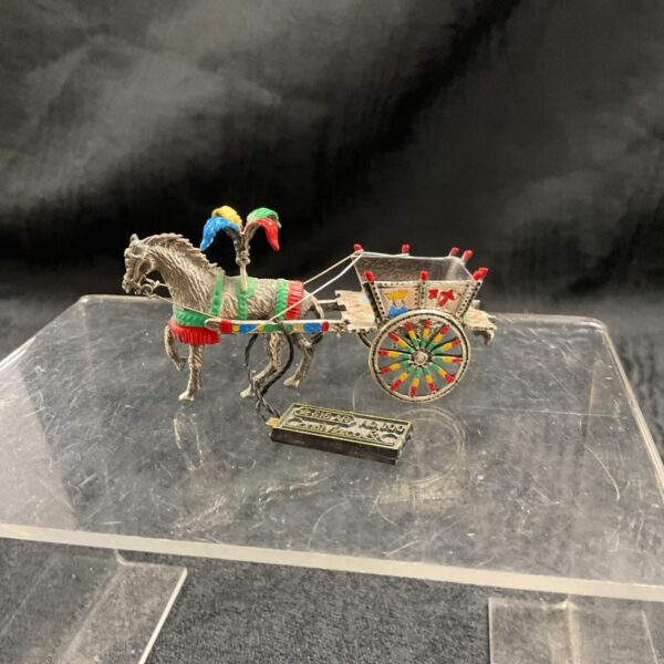 Antique silver carnival horse and cart figurine, detailed and colourful.