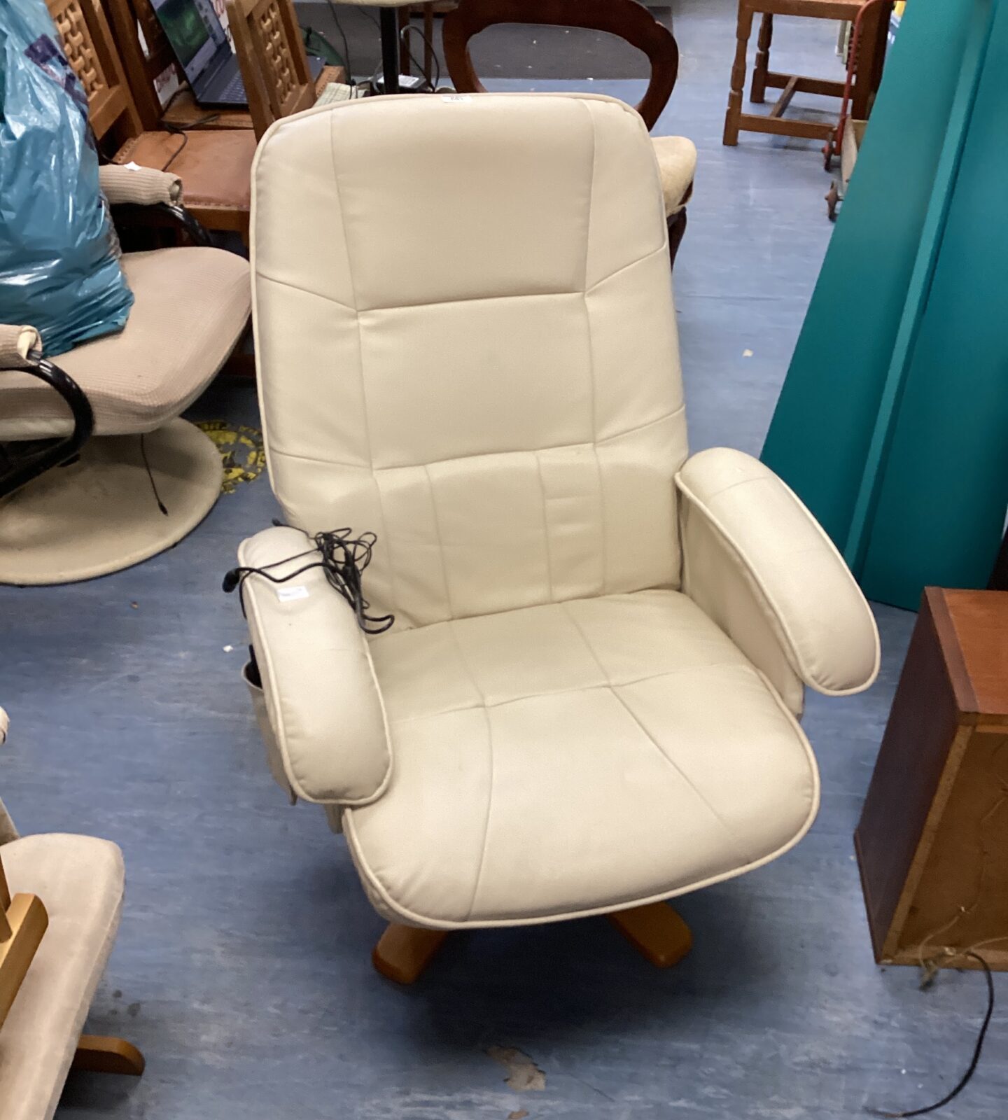 Cream leather reclining massage armchair
