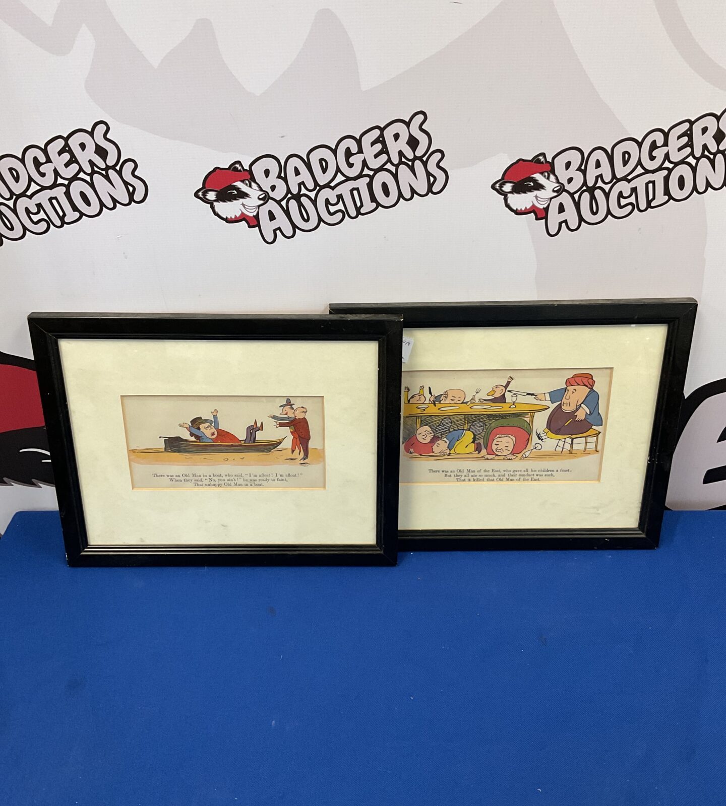 Two framed comical rhyme prints