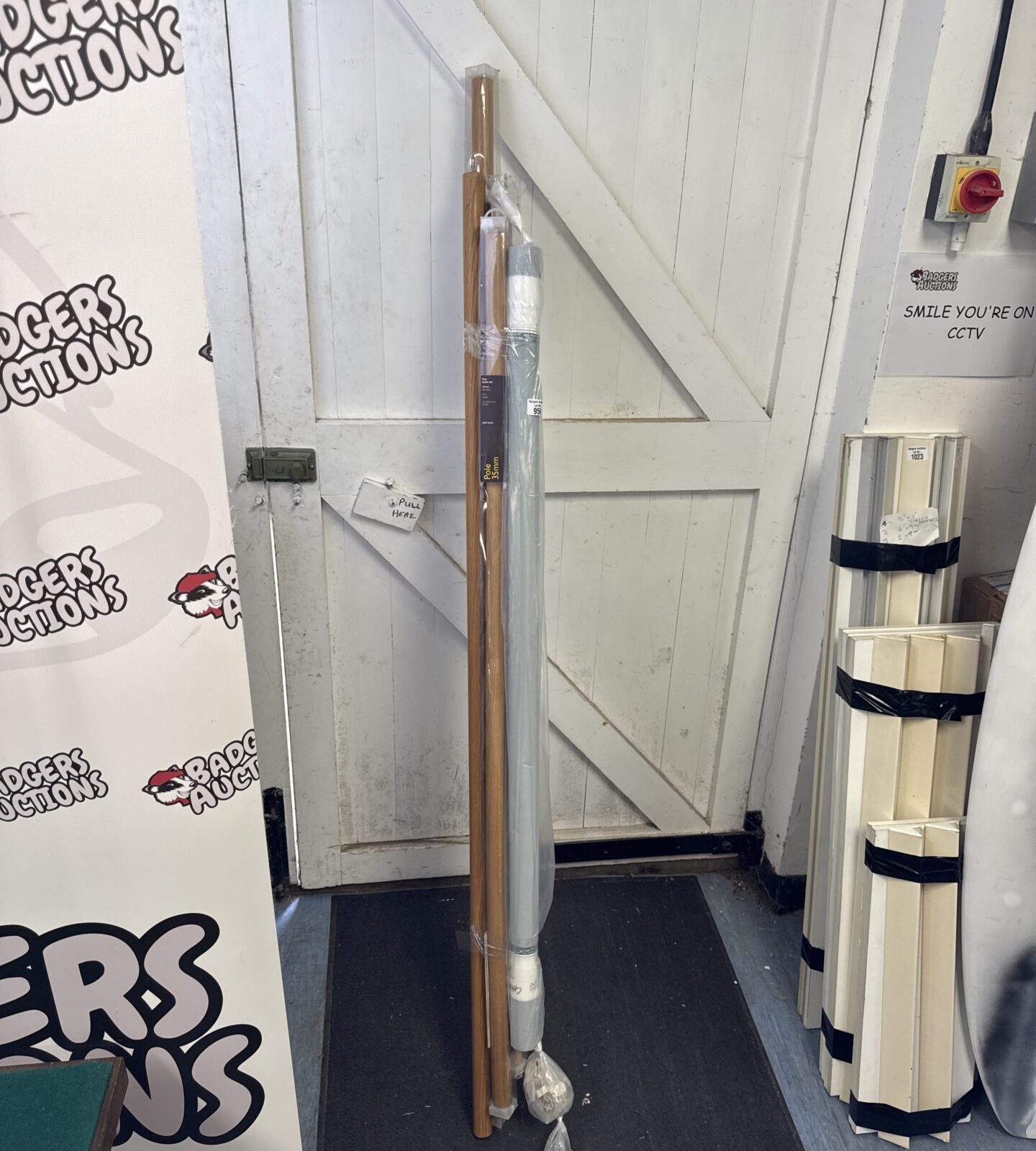 Bundle of curtain rail poles & a grey drop blind