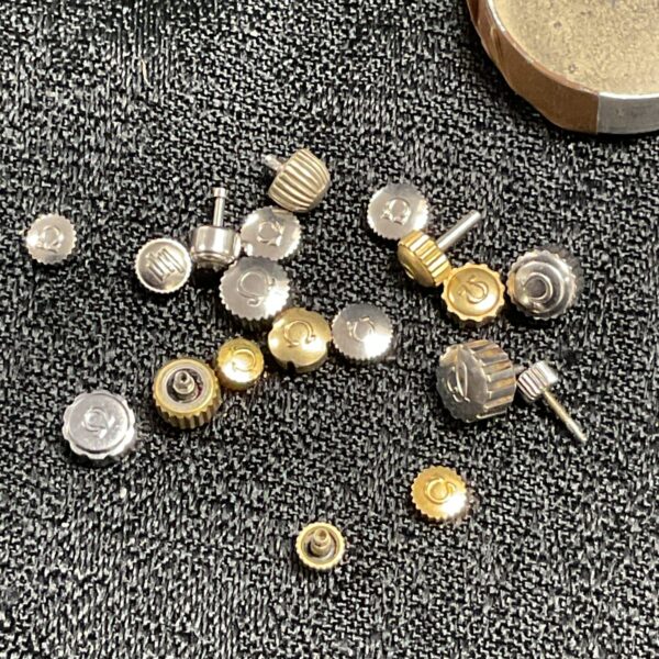 Lot of omega Breitling and cartier Watch crowns all genuine 19 all together( majority omegas)