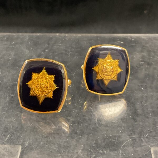 Vintage South African Police cufflinks with a crested design.