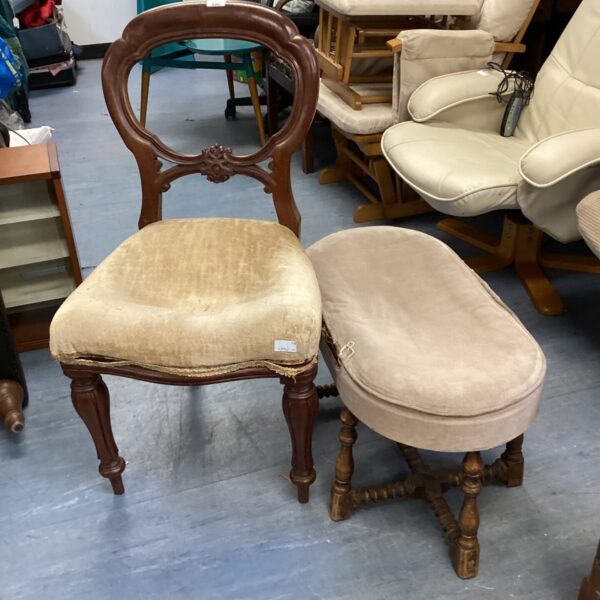 Antique balloon back chair and footstool set with patterned upholstery.