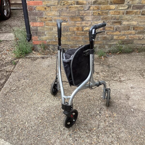 Silver Free Style walking aid trolley with basket for mobility assistance.