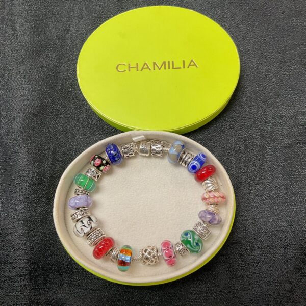 Silver Chamilia charm bracelet with colourful Murano glass charms.