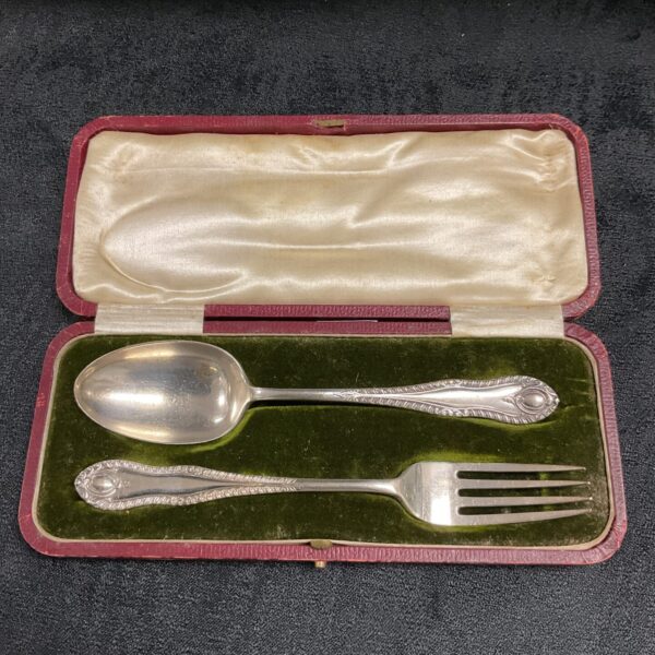 Antique silver christening set with spoon and fork in a case.