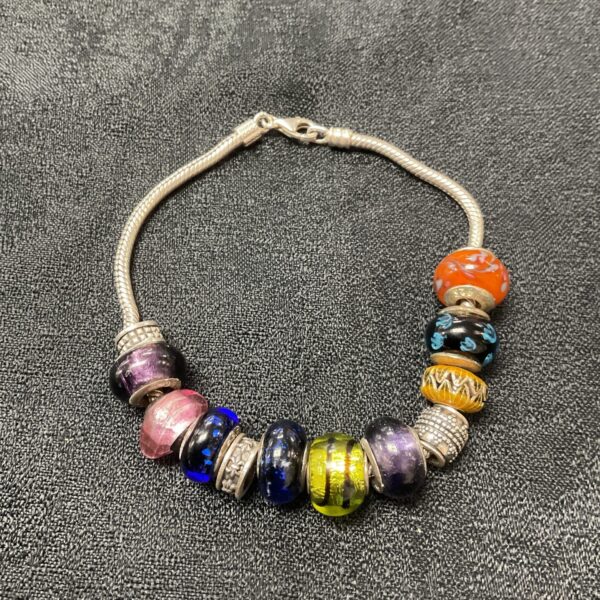 Silver bracelet with colourful Murano glass Charms Inc charms.