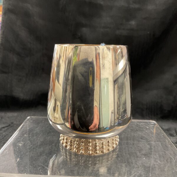 Silver plate Mappin and Webb beaker with gilt interior on display.