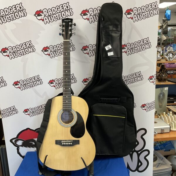 Used Martin Smith acoustic guitar with included carrying case.