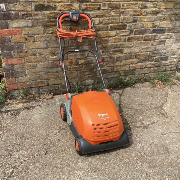 Vintage Flymo Lawnrake Compactor 3400 garden tool for lawn care.