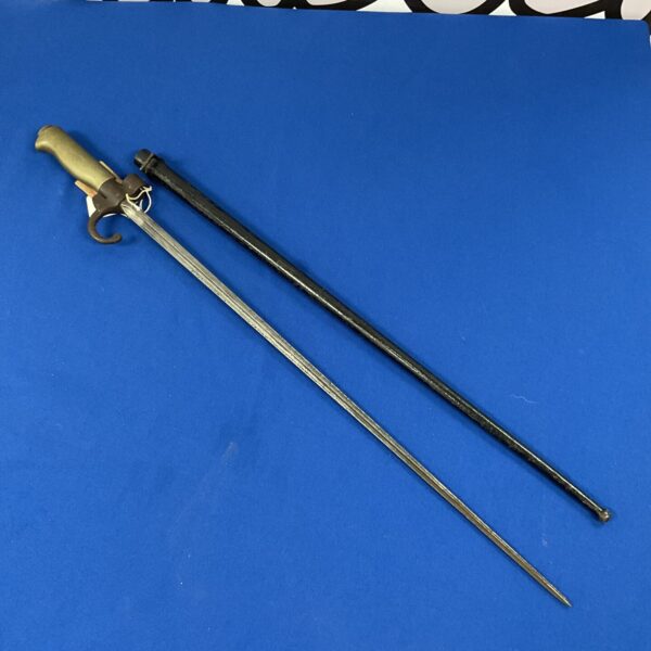 Antique French Lebel bayonet with scabbard, a WWI military collectible.