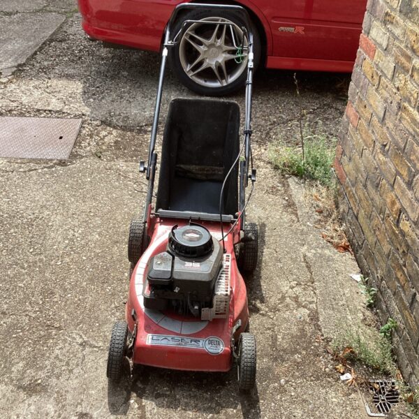 Vintage Laser 35 petrol lawn mower needing repair.