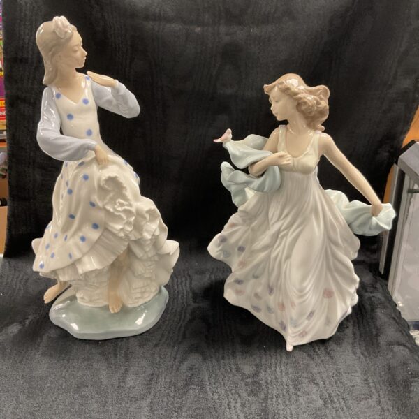 Two Porcelain figures One 13”  NAO Spanish Dancer And 10” Lladro Girl With Bird