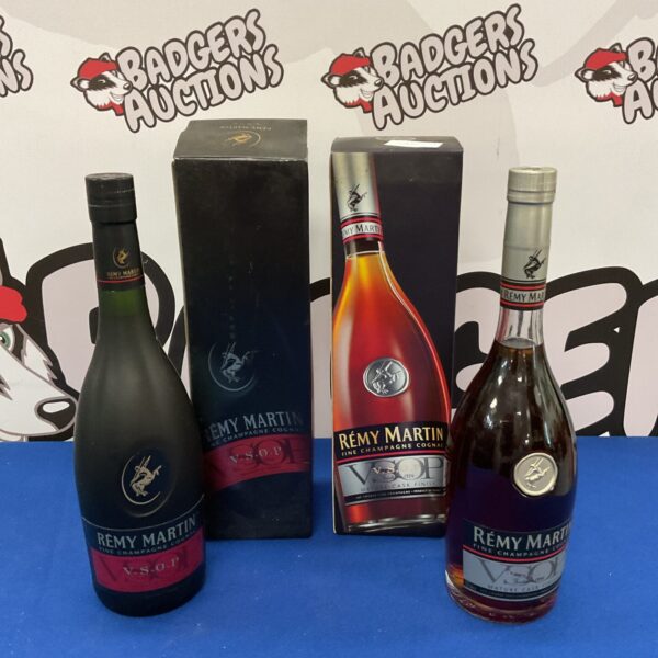 Two sealed bottles of Remy Martin Fine Champagne Cognac for collectors.