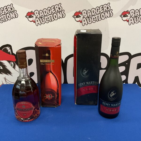 Sealed bottles of brandy and Remy Martin Fine Champagne Cognac.