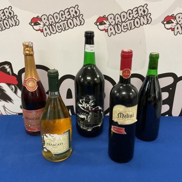 Wine lot featuring Melini Chianti and Muscador bottles for collectors.