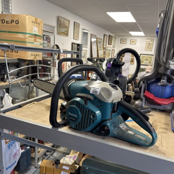 Used Makita DCS3501 petrol chainsaw for garden and forestry work.