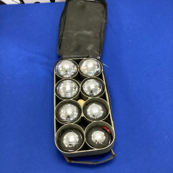 Vintage garden boules set with eight steel boules in canvas case.