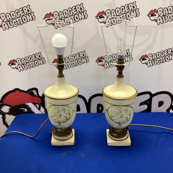 Vintage cherub urn table lamps, a decorative lighting pair.