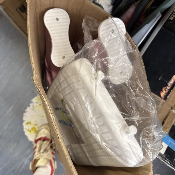 Children’s toilet training ladder in a cardboard box.