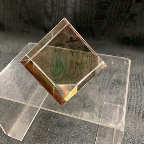 Antique Chinese glass paperweight with painted scene and calligraphy.