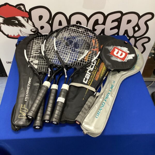 Bundle of tennis and badminton rackets including a Wilson racket.
