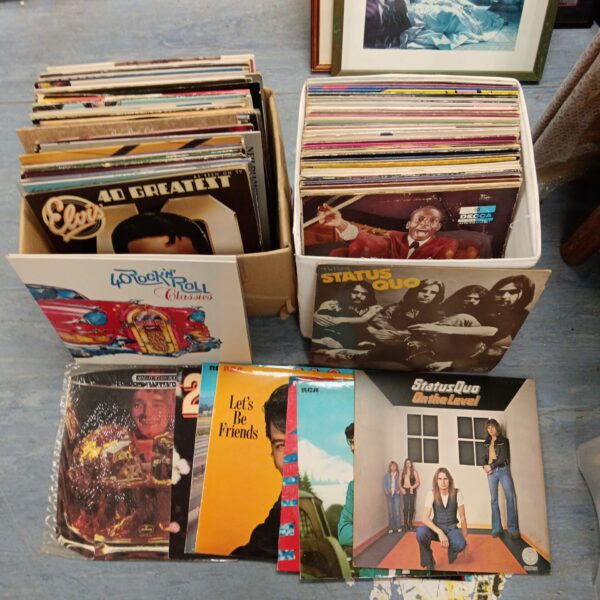 Two boxes of 12" vinyl records including status quo