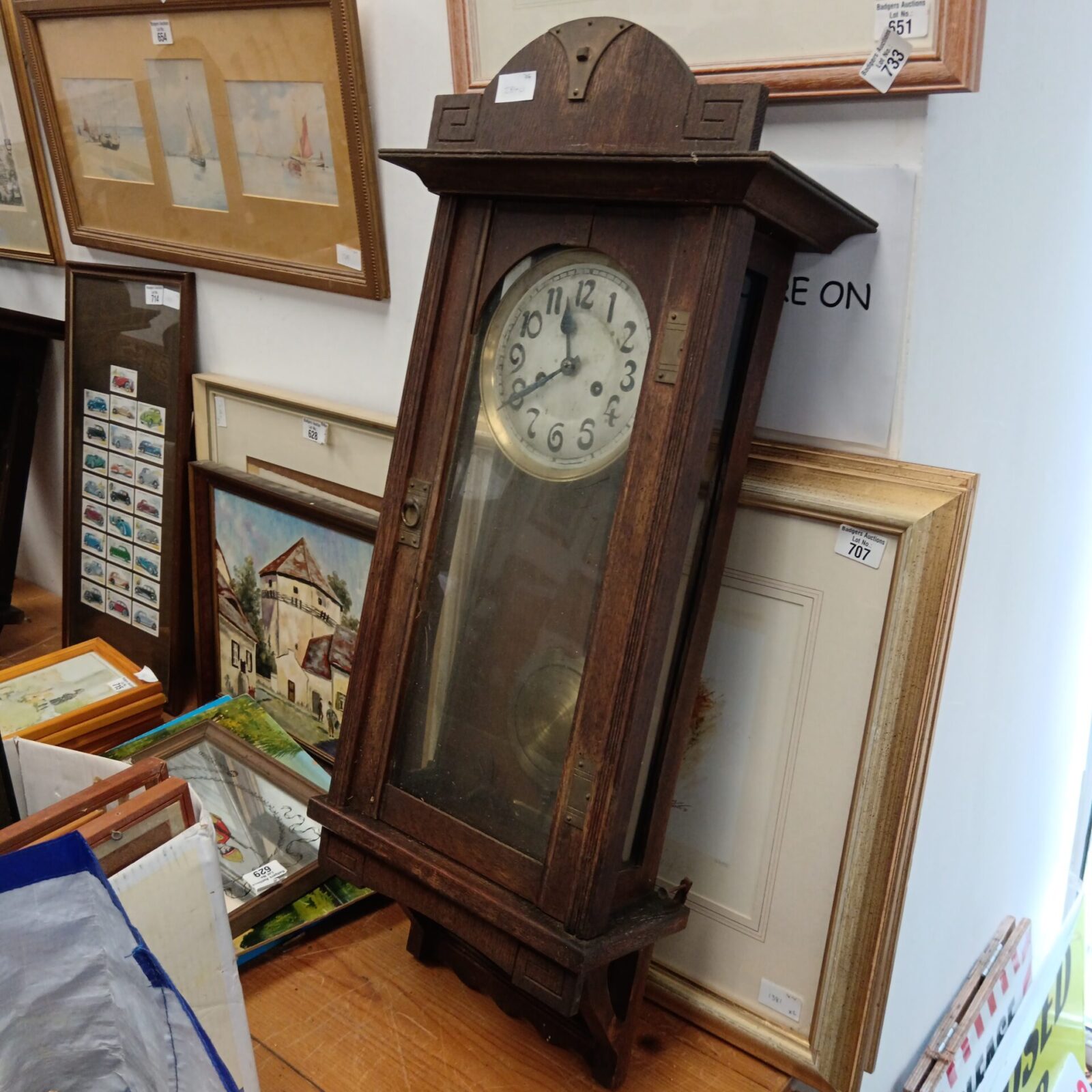 Antique oak cased wall clock with key & pendulum