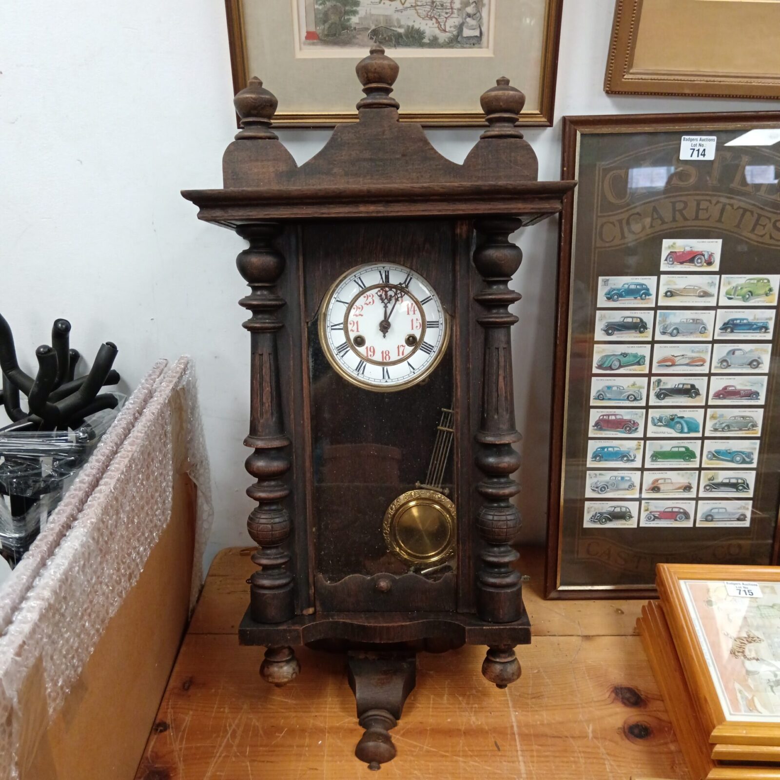Antique oak cased wall clock with pendulum and key