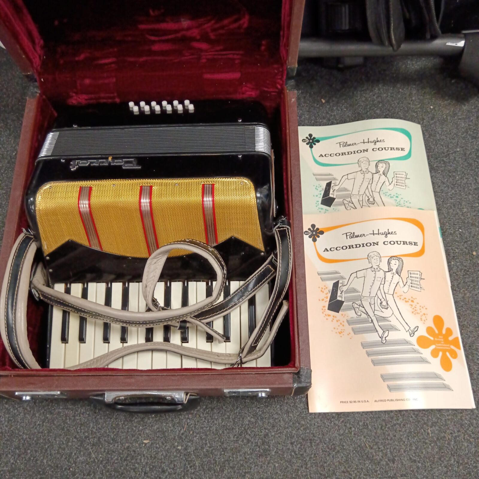 Vintage Parrott accordion in case with books
