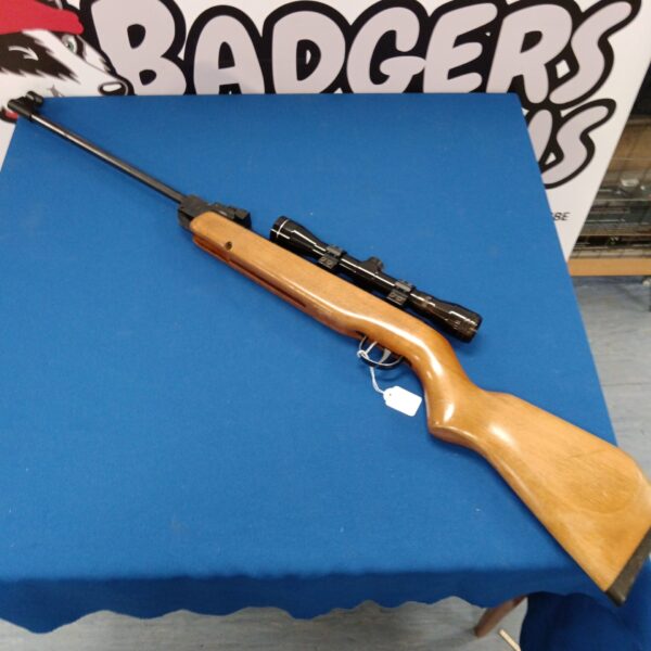 Vintage Webley Hawke MKII .22 air rifle with scope attached.