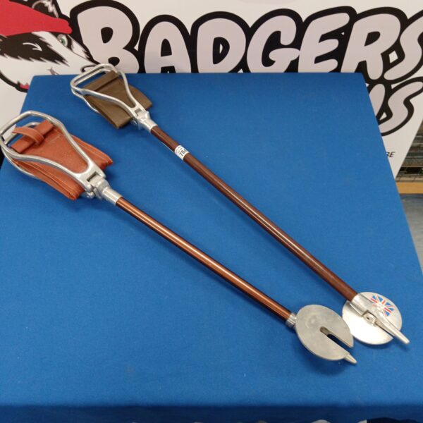 Two leather seated shooting sticks