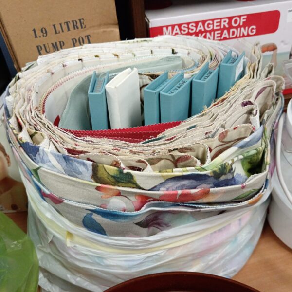 Voyage fabric samples with vibrant floral and botanical designs.