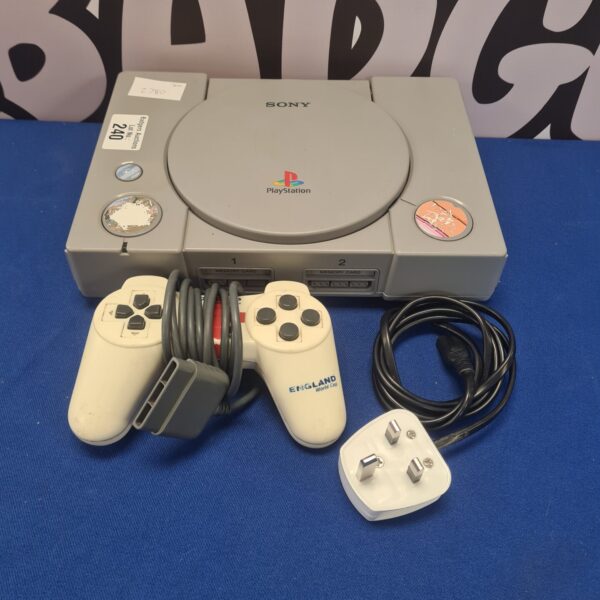 Sony PlayStation 1 console with controller and power cable.