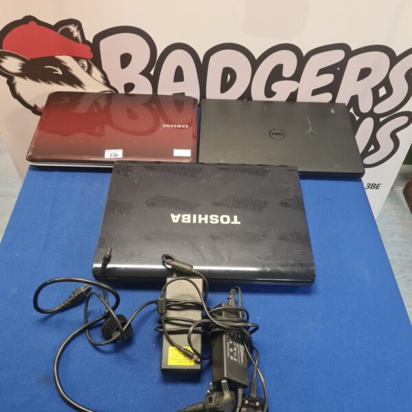 Bundle of used laptops including Toshiba, Dell, and Samsung models.