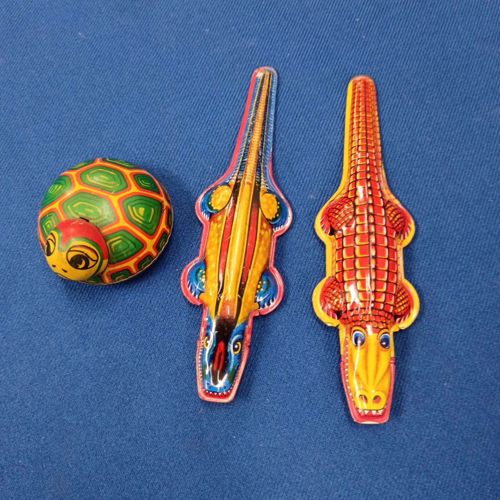 Two vintage Japanese tin crocodile whistles & tin plate tortoise